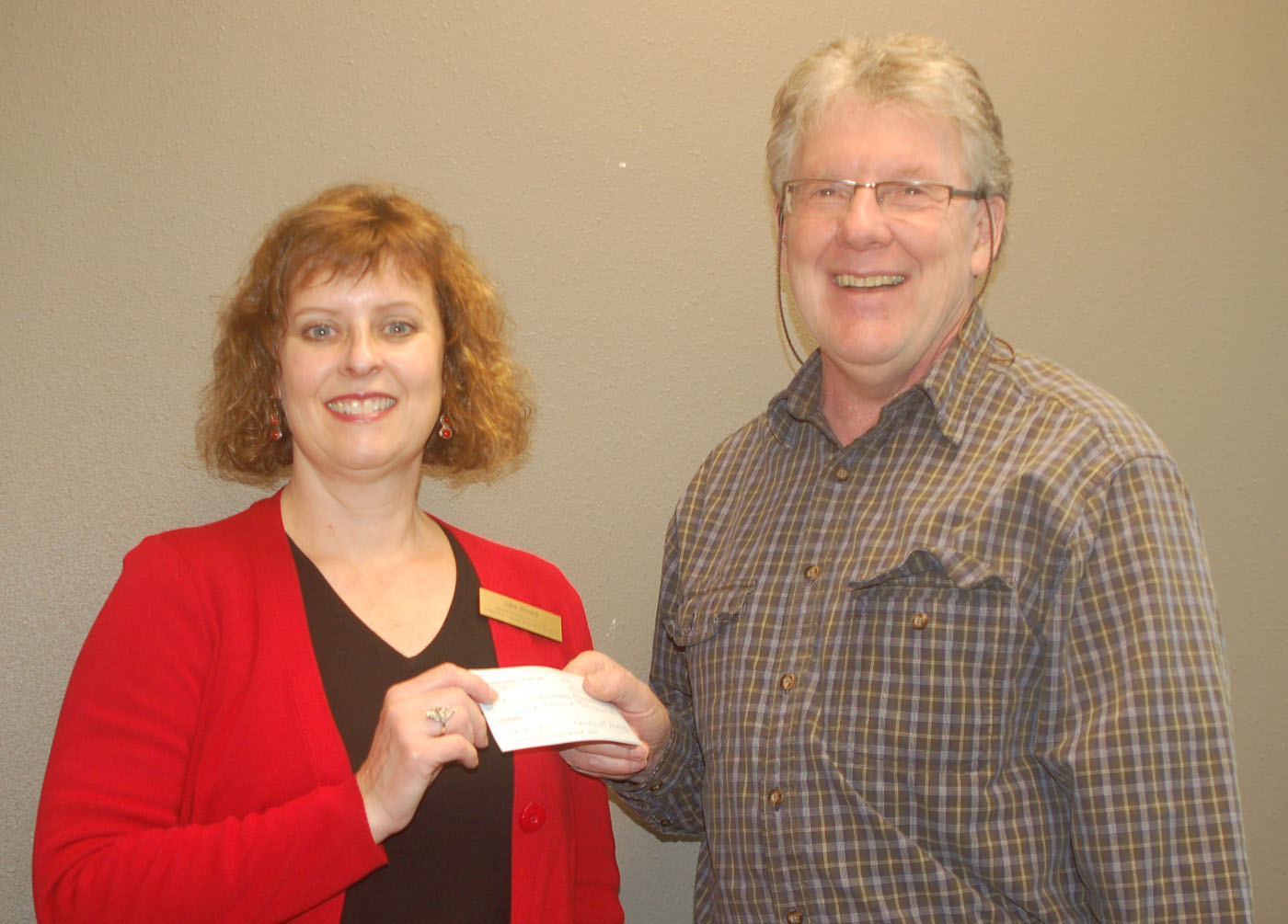 Vancouver Heights: Vancouver Bridge Club President Steve Tubbs presents a $210 check on Jan.