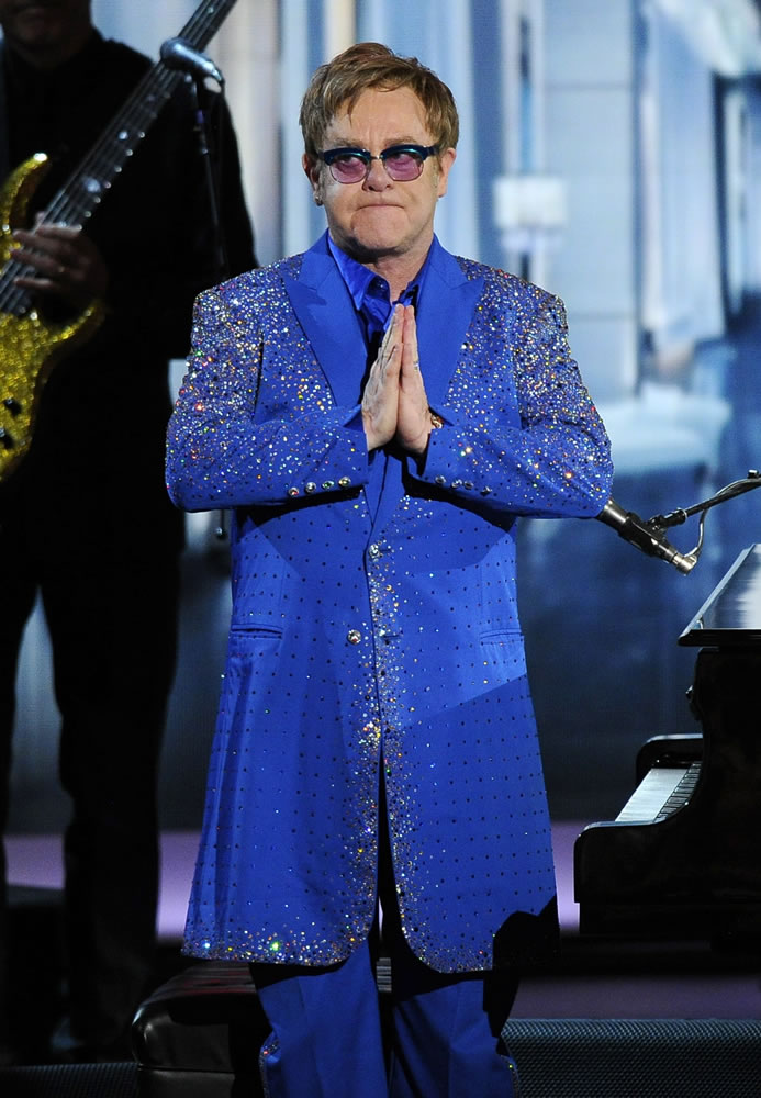 Elton John appears on stage after performing &quot;Home Again&quot; Sunday at the 65th Primetime Emmy Awards at Nokia Theatre in Los Angeles.