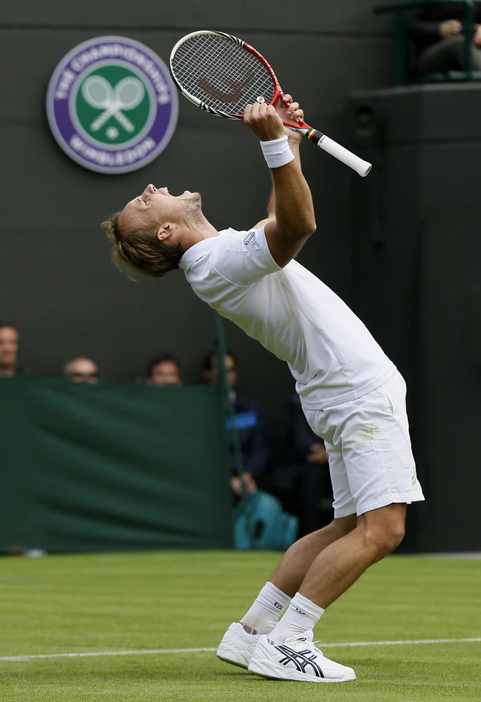 Steve Darcis of Belgium reacts as he defeats Rafael Nadal of Spain in their first round singles match at Wimbledon on Monday.