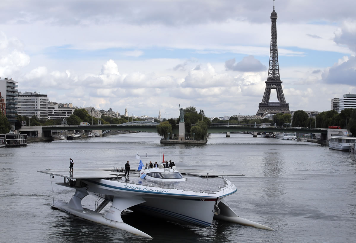 The Turanor PlanetSolar, the world's largest solar boat, travels on the Seine river near The Eiffel Tower in Paris on Tuesday.