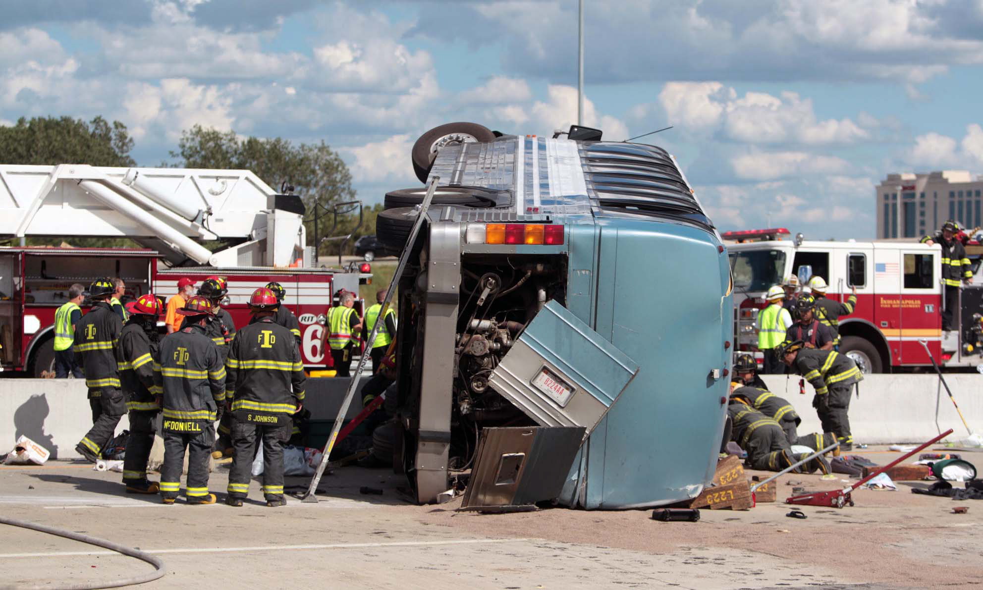 Firefighters work to extricate people from a bus crash Saturday in Indianapolis.