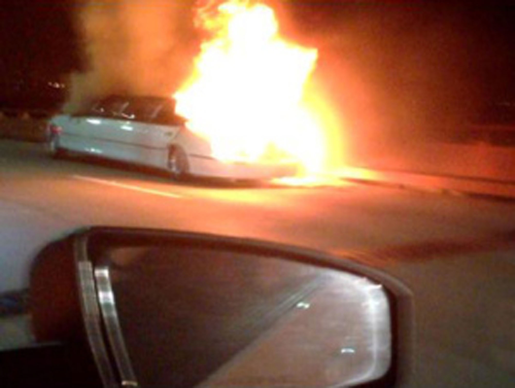 Flames erupt from a limousine Saturday on the San Mateo-Hayward Bridge in San Francisco.