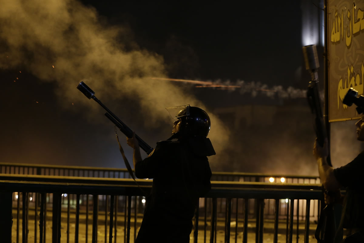 Egyptian security forces fire tear gas toward supporters of ousted President Mohammed Morsi on Monday during clashes in downtown Cairo, Egypt.