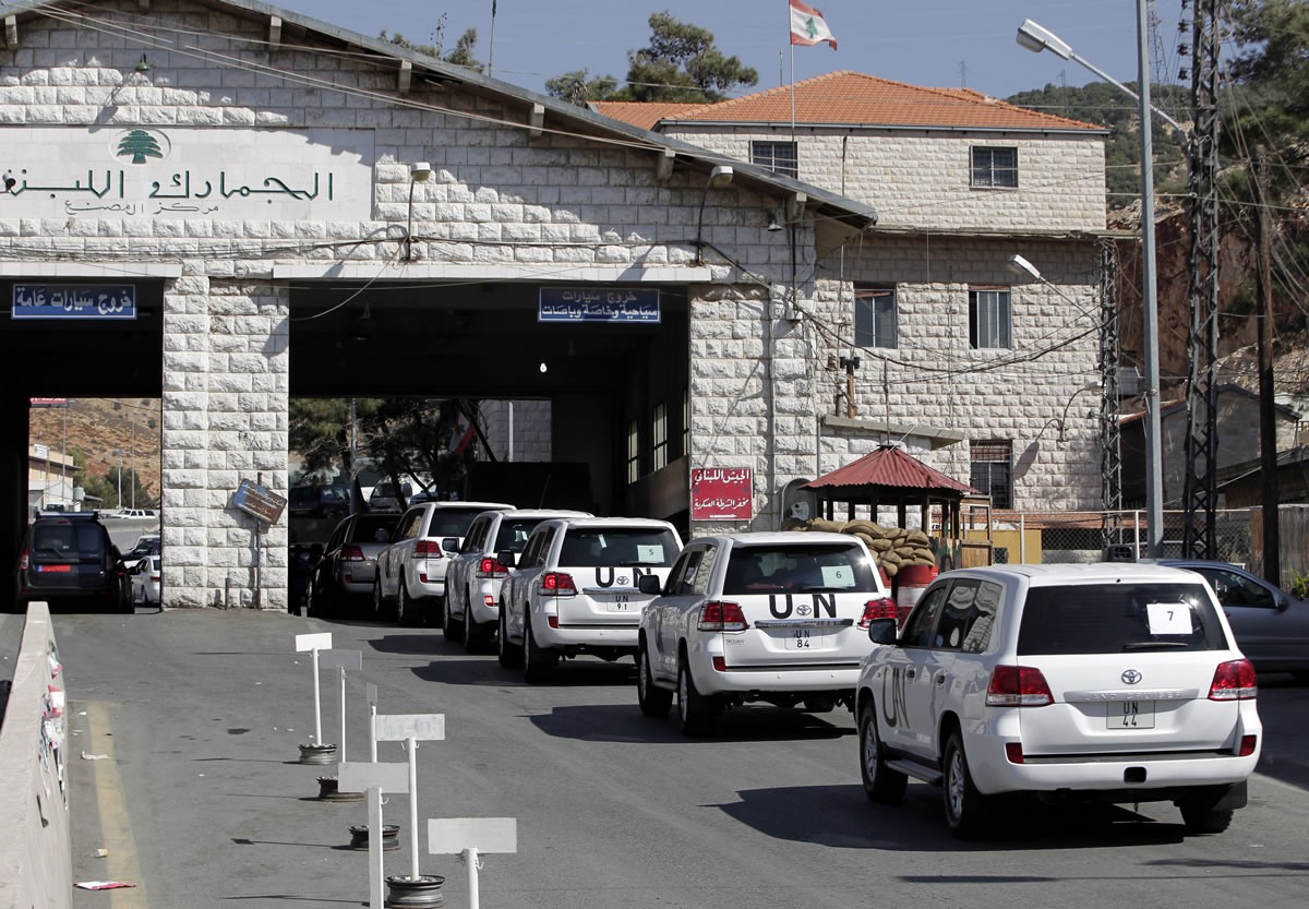 A convoy of inspectors from the Organization for the Prohibition of Chemical Weapons prepares cross into Syria at the Lebanese border crossing point of Masnaa, eastern Bekaa Valley, Lebanon, on Tuesday.