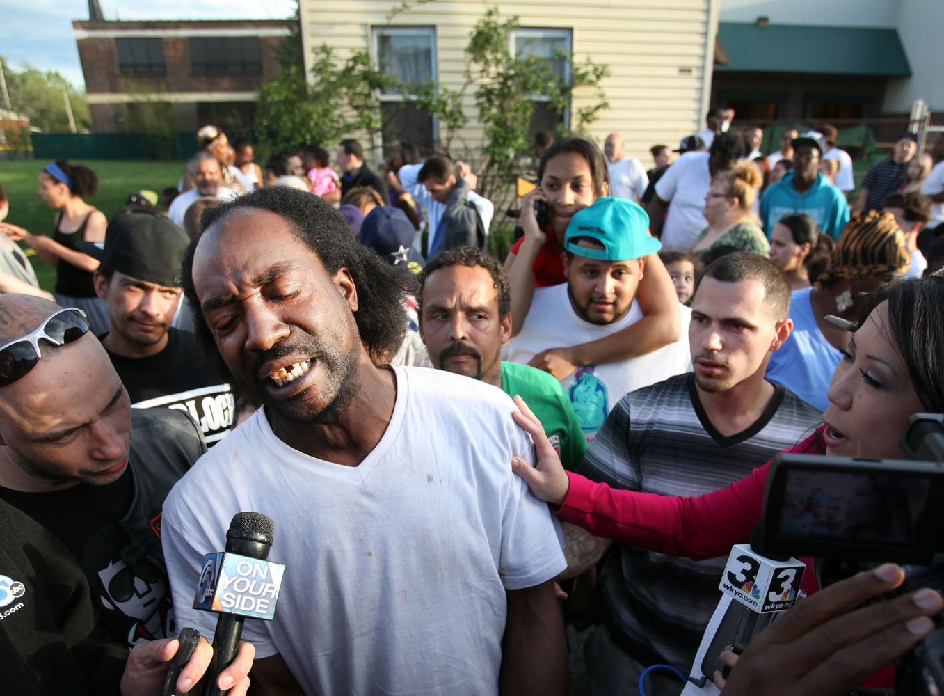 Neighbor Charles Ramsey speaks to media near the home on the 2200 block of Seymour Avenue, where three missing women were rescued in Cleveland on Monday.