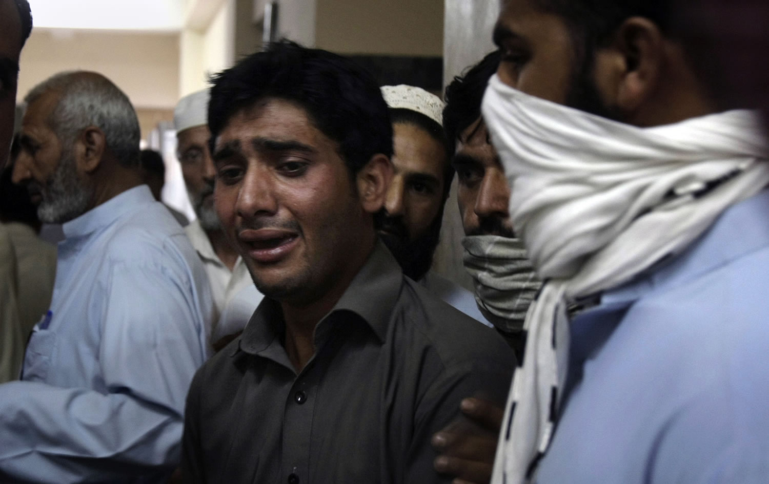 A Pakistani mourns the death of his relative, a victim of a suicide bombing, at a hospital in Mardan, Pakistan, on Tuesday.