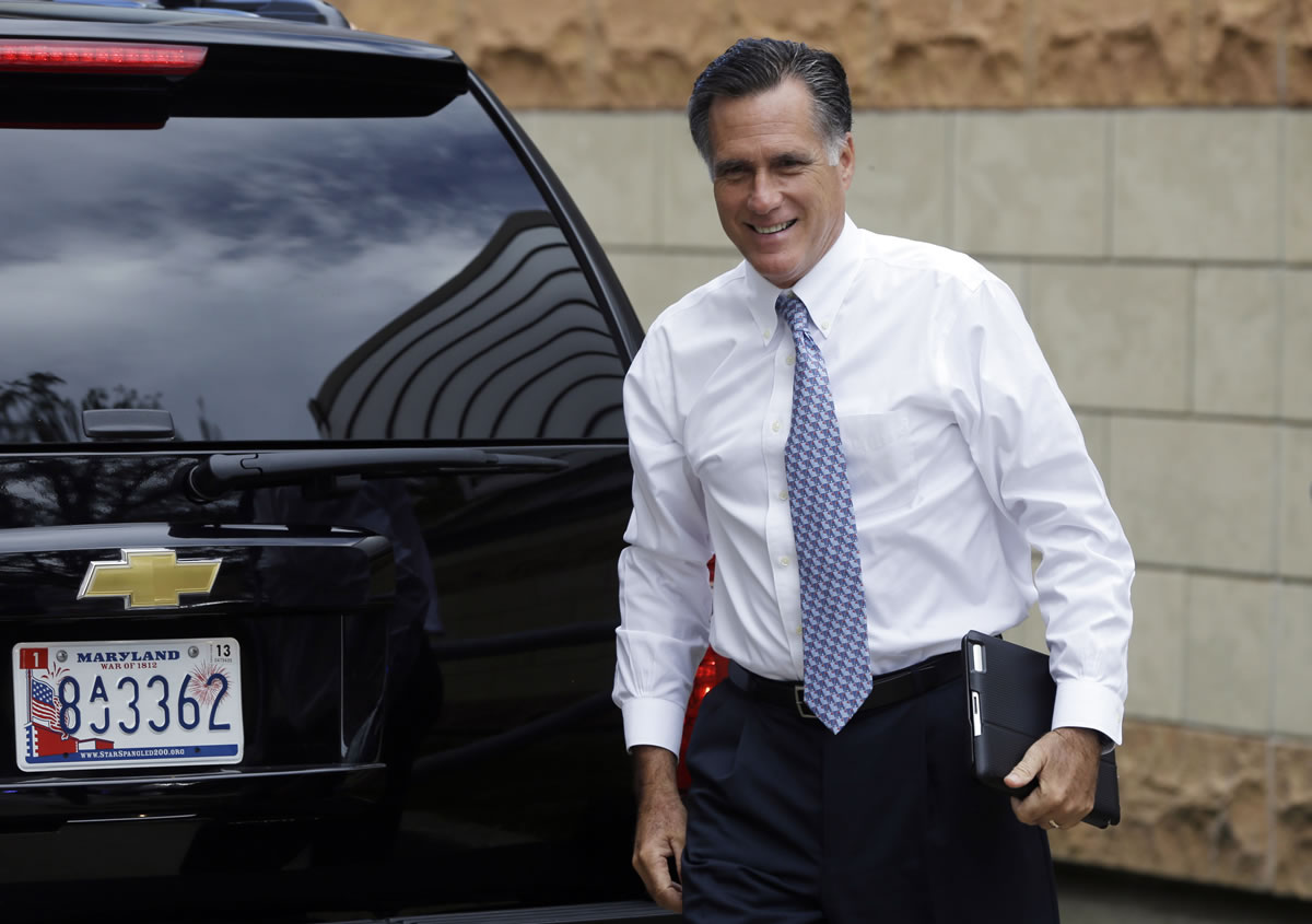 Republican presidential candidate Mitt Romney arrives at his campaign headquarters in Boston, to prepare for the presidential debates, Sunday.
