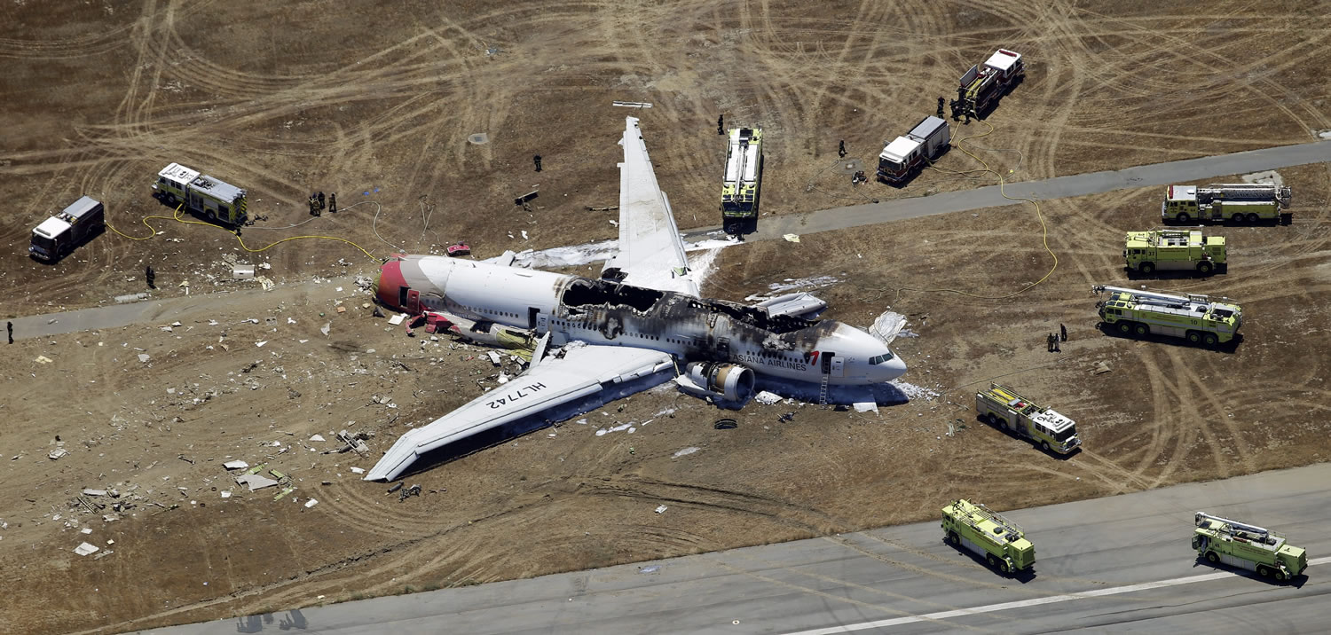 The wreckage of Asiana Flight 214 lies on the ground after the jetliner crashed at the San Francisco International Airport on Saturday.
