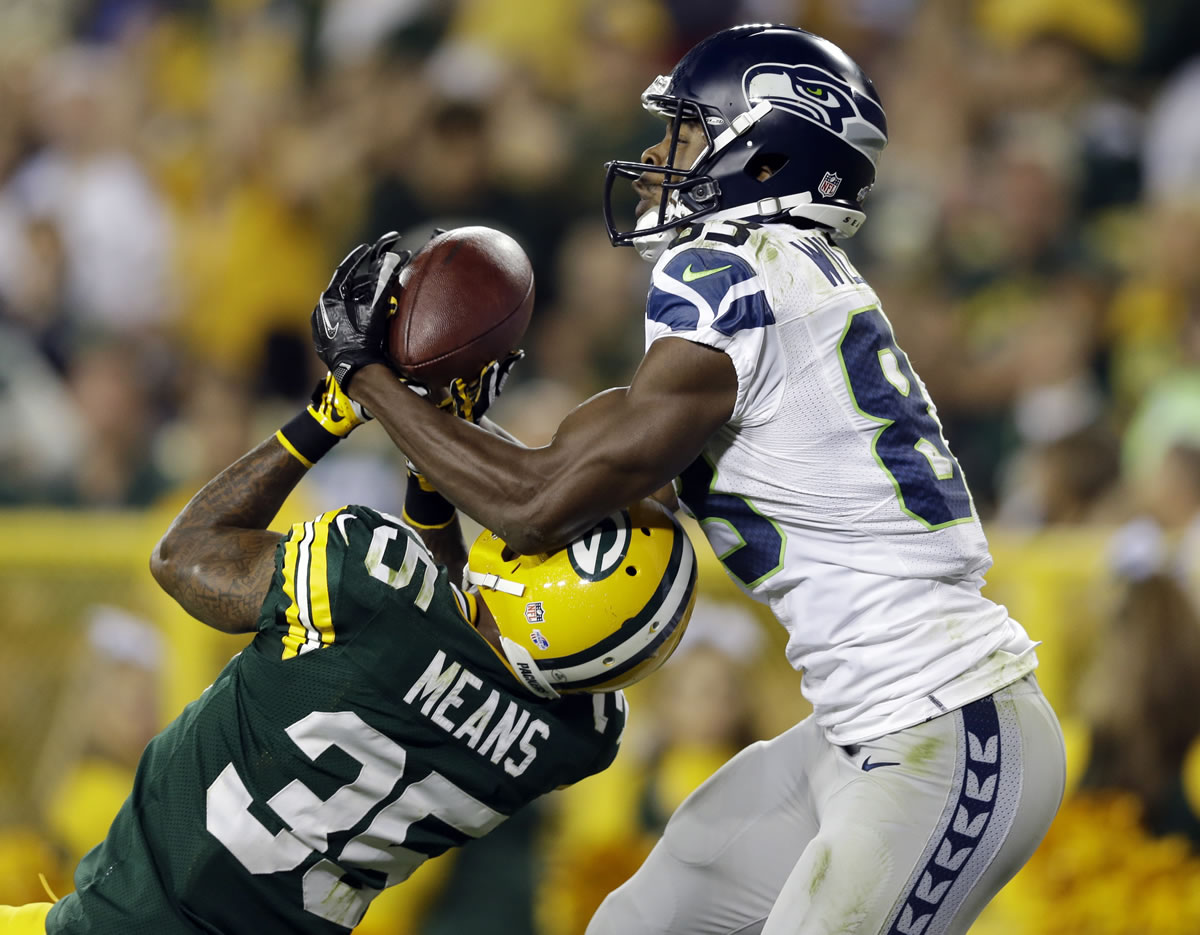 Seattle Seahawks' Stephen Williams catches a touchdown pass over Green Bay's Loyce Means during the second half Friday.