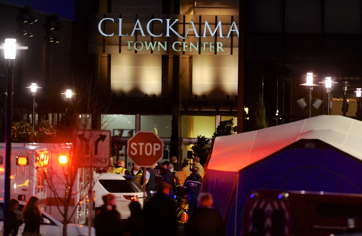 Police and medics work the scene of a multiple shooting at Clackamas Town Center Mall in Clackamas, Ore., Tuesday.