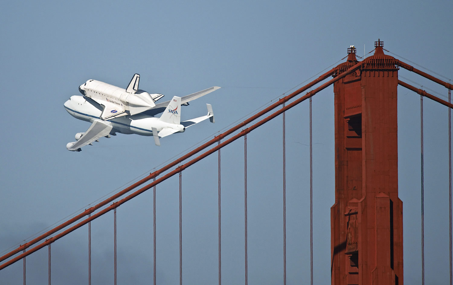 The space shuttle Endeavour passes over the Golden Gate Bridge in San Francisco, Friday.