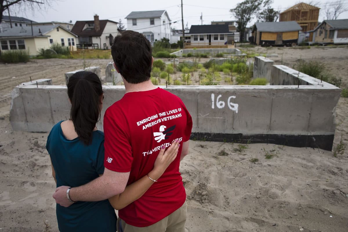 Joe Quinn and his wife, Melanie, visit the remains of his parents' home that was destroyed by Superstorm Sandy in the Breezy Point neighborhood of New York's Queens borough.