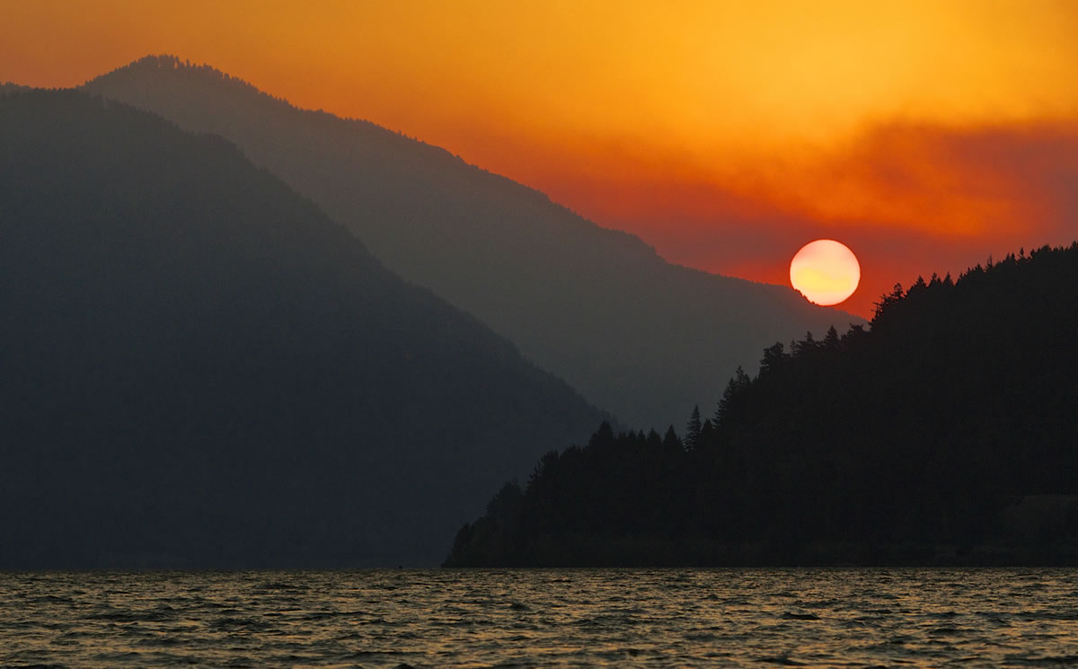 Smoke from a wildfire near White Salmon is visible from the Columbia River near Cascade Locks, Ore., on Thursday.