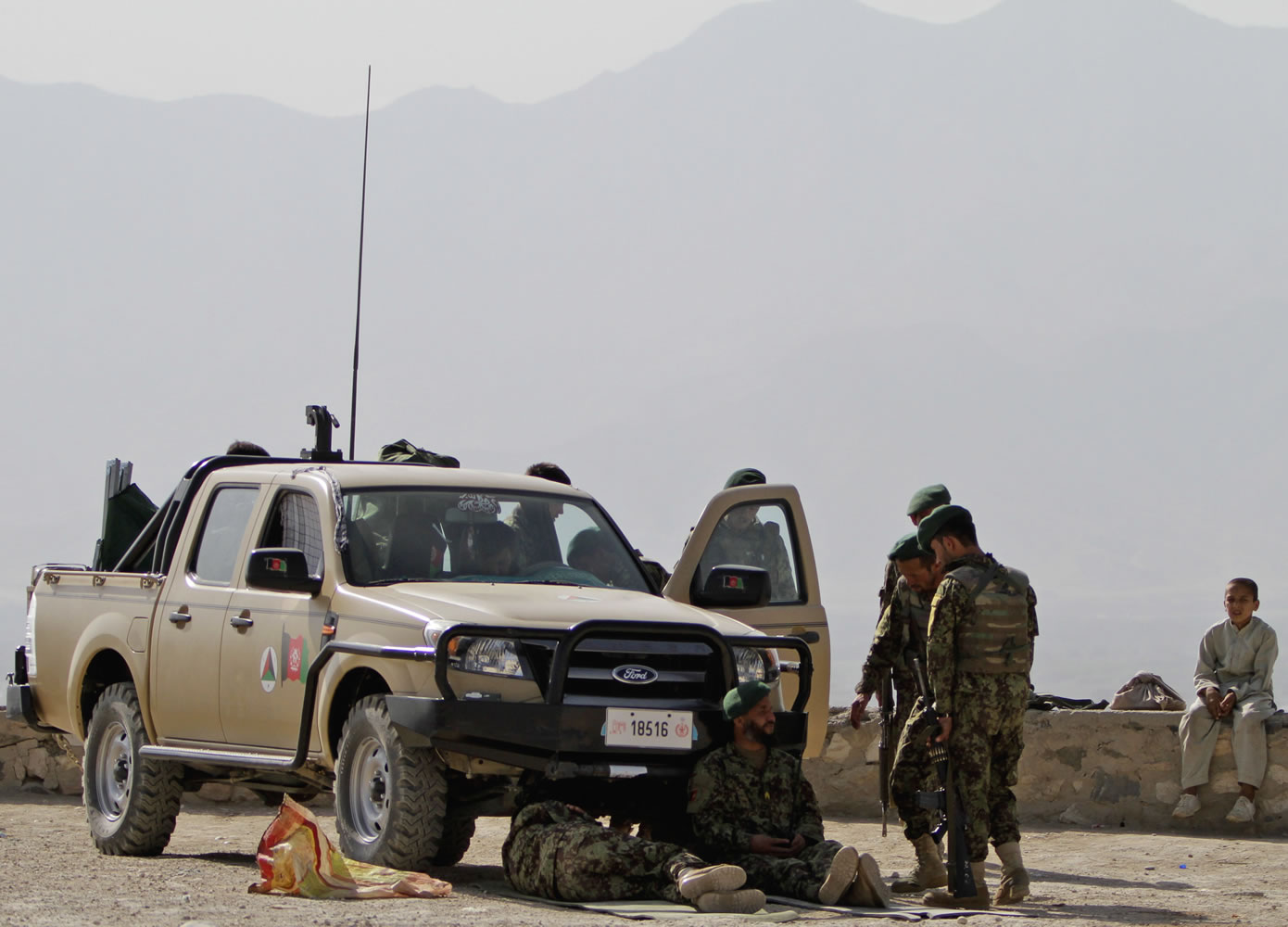 Afghan National Army chat during a break at Nader Khan Hill in Kabul, Afghanistan, on Monday.