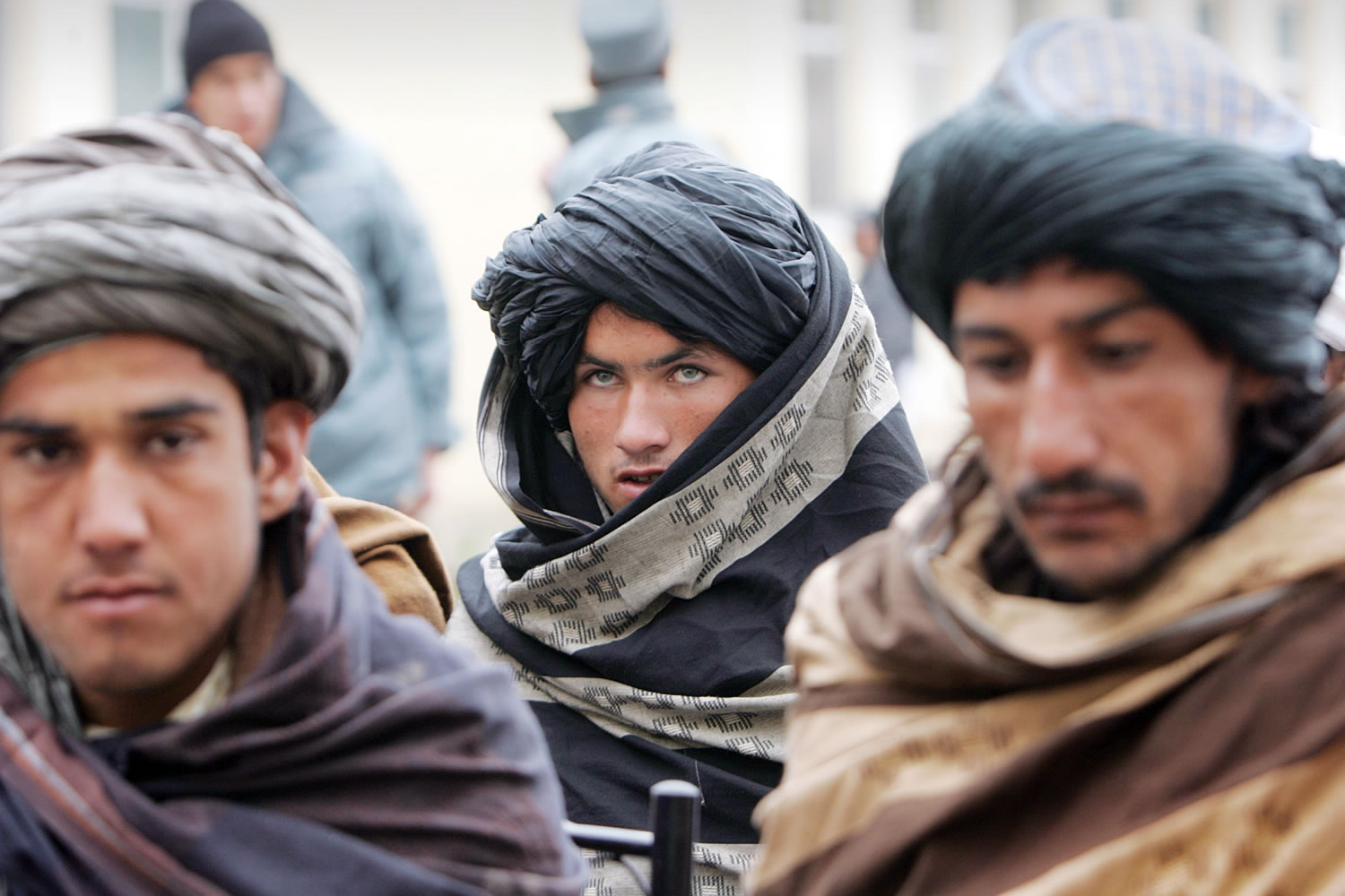 Former Taliban militants attend a ceremony after handing over their weapons in Herat, Afghanistan.
