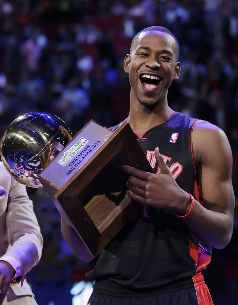 Terrence Ross of the Toronto Raptors holds up the trophy after winning at the slam dunk contest.