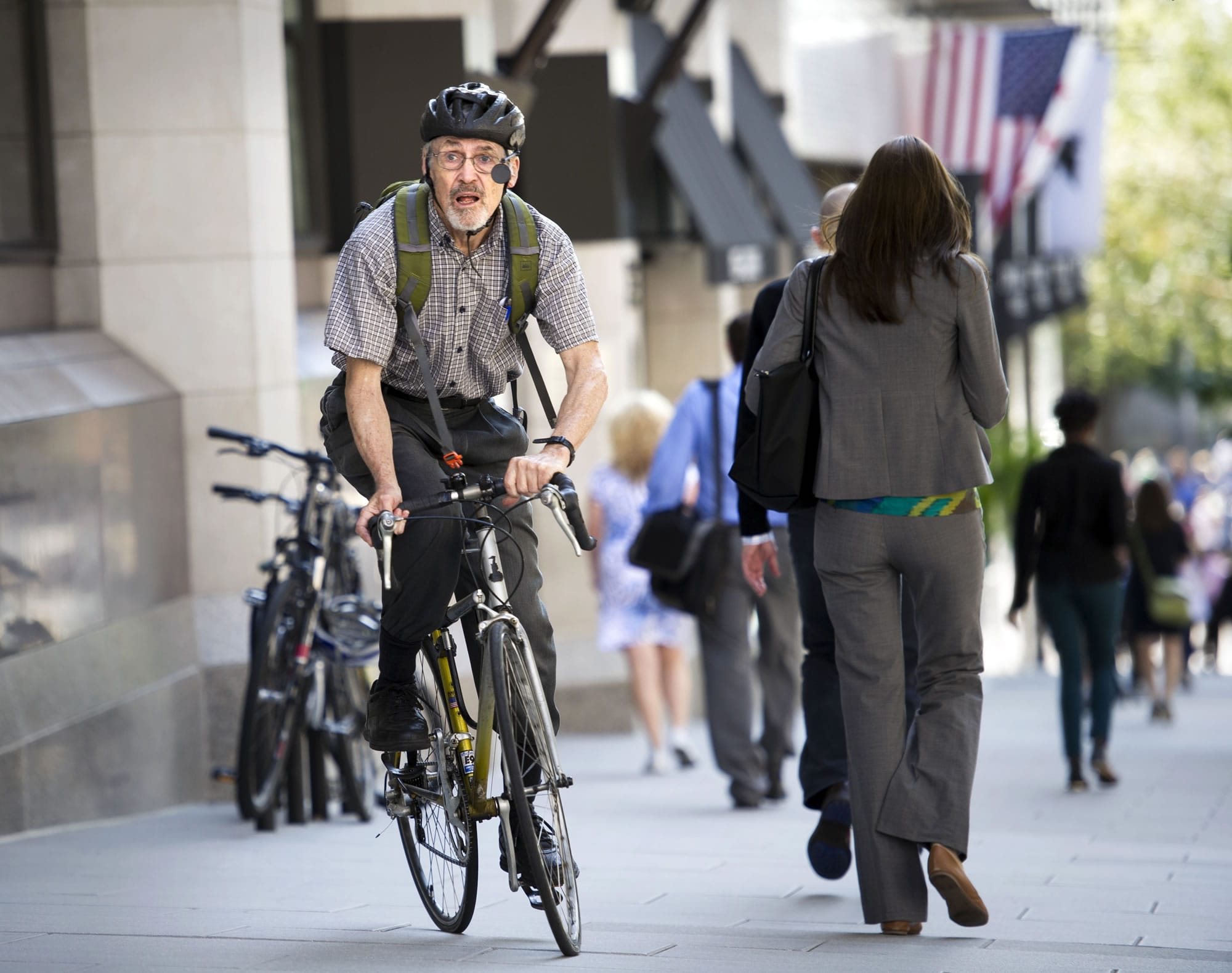 David Hilfiker, of Washington, D.C., leaves the National Press Club on his bike Sept. 19 after talking about his life with Alzheimer's disease.