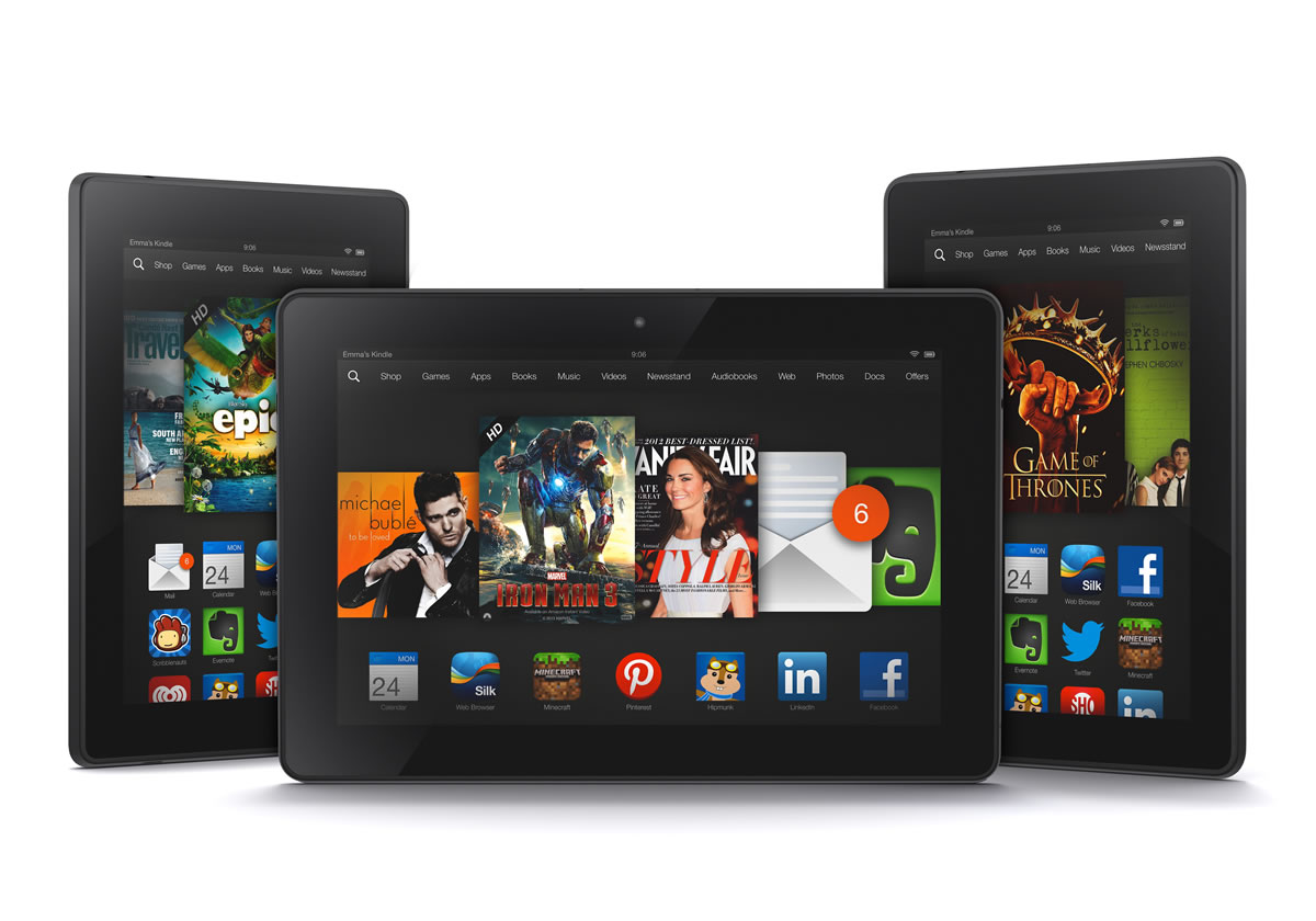 The new 8.9-inch Amazon Kindle HDX tablet computer, center, the 7-inch Kindle HDX, left, and the updated Kindle HD.