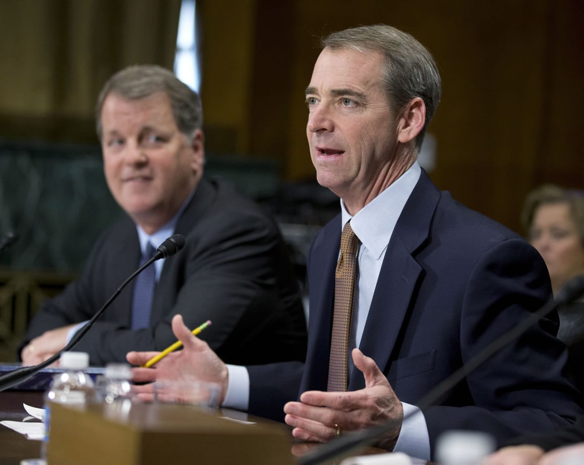 American Airlines and AMR Corporation Chairman, President and CEO Thomas Horton, right, accompanied by US Airways Group Chairman and CEO Douglas Parker, testifies on Capitol Hill in Washington on March 19.