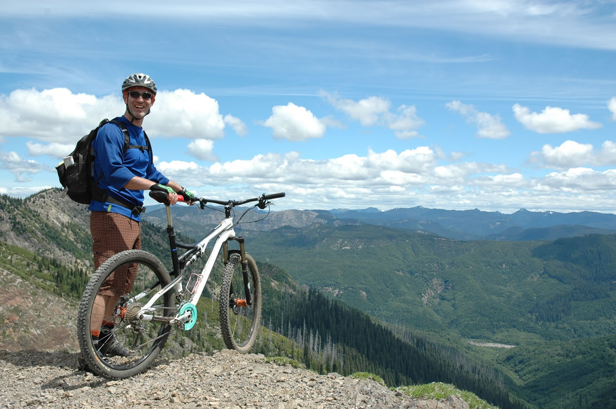 Paul Karr of Bend stops for a break overlooking the headwall of Ape Canyon on the southeast side of Mount St.