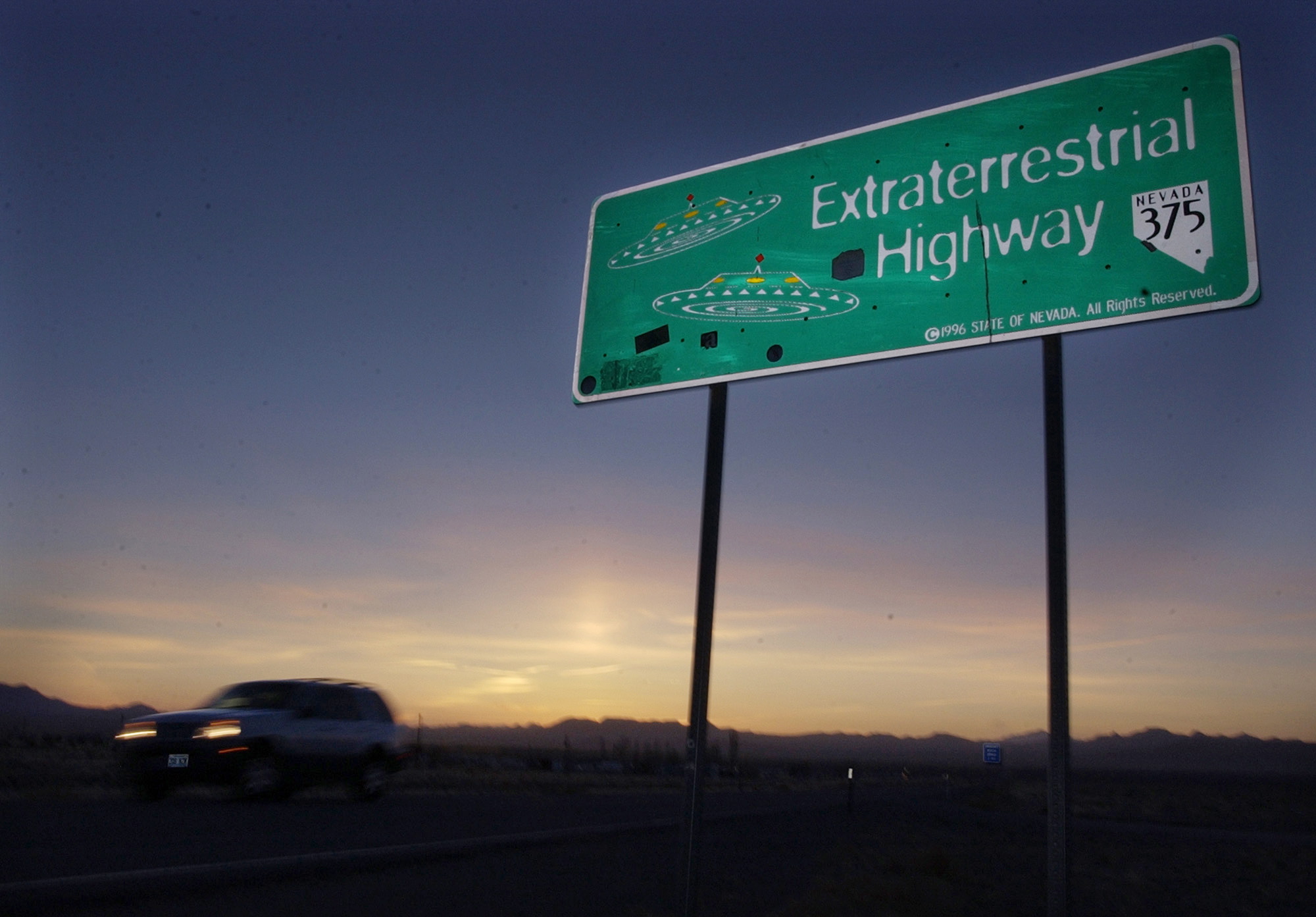 A car moves along the Extraterrestrial Highway near Rachel, Nevada, in this Wednesday, April 10, 2002 file photo. The ET highway was established by the Nevada Legislature in 1996 and runs along the eastern border of Area 51, a military base on the Nevada Test Site.