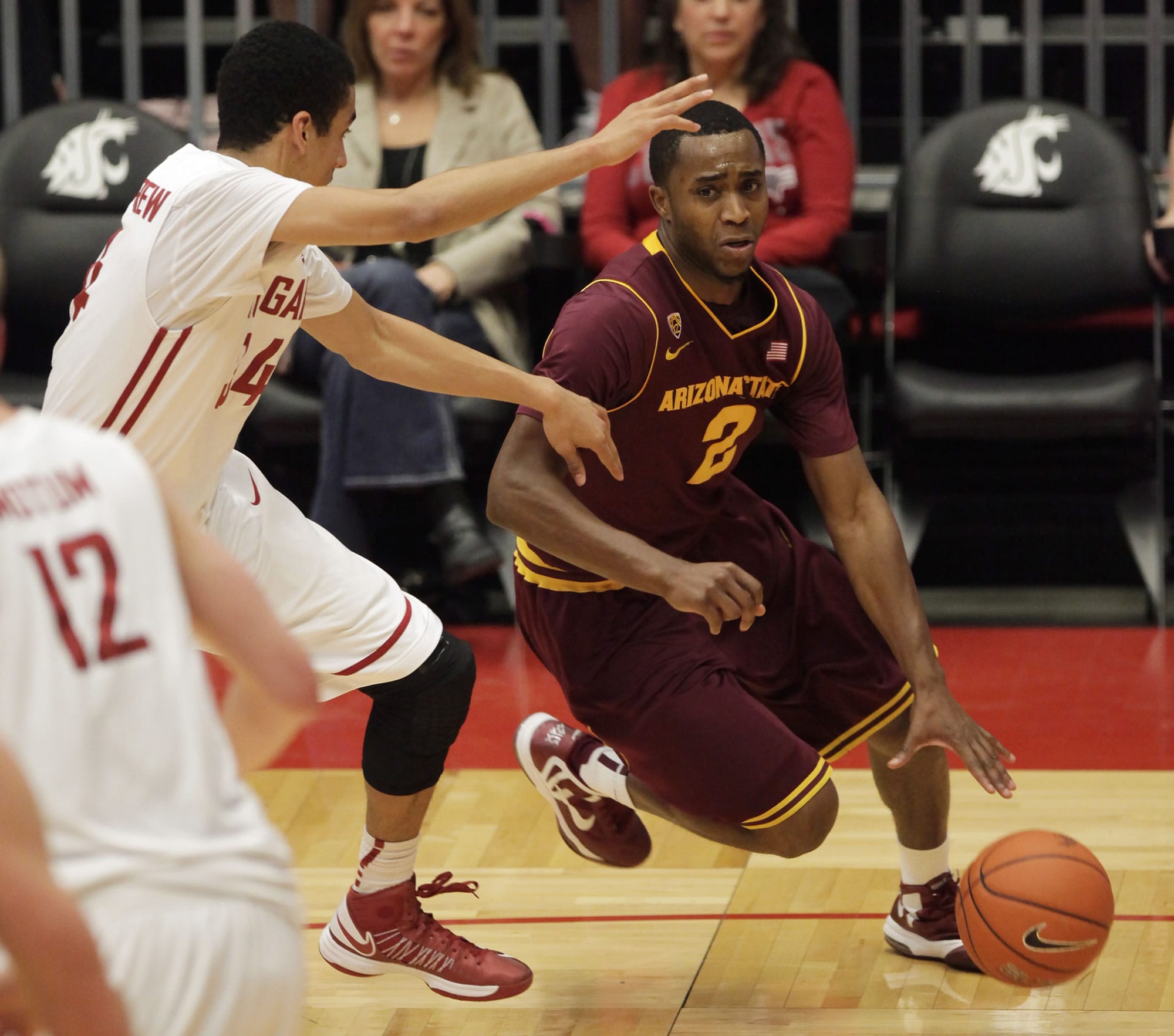 Arizona State guard Chris Colvin (2) drives around Washington State guard Dexter Kernich-Drew, left, during the second half of an NCAA college basketball game, Thursday, Jan. 31, 2013, in Pullman, Wash. Arizona State won 63-59.