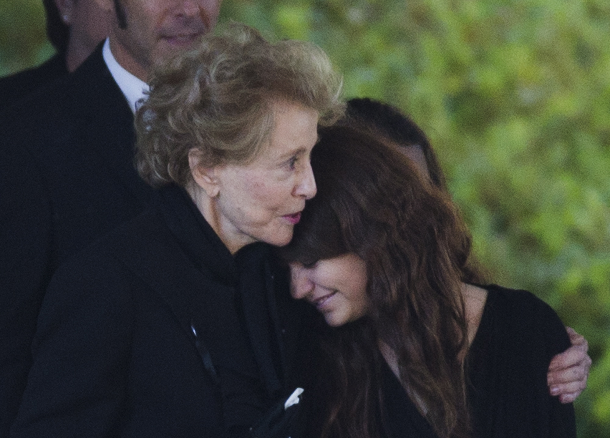 Joan Specter, left, hugs a woman as she and others leave Har Zion Temple after the funeral for her husband, former U.S. Sen. Arlen Specter, on Tuesday in Penn Valley, Pa. Family members say Specter died Sunday of complications from non-Hodgkin lymphoma.