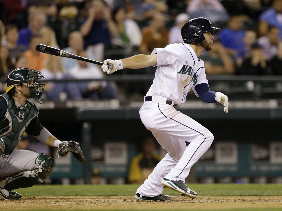 Seattle Mariners' Nick Franklin drives in a pair of runs against the Oakland Athletics in the eighth inning Saturday.