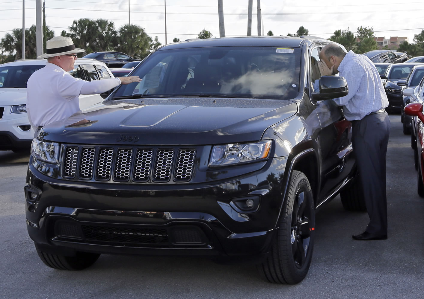 A customer checks out the interior of a 2015 Grand Cherokee Limited in Doral, Fla.