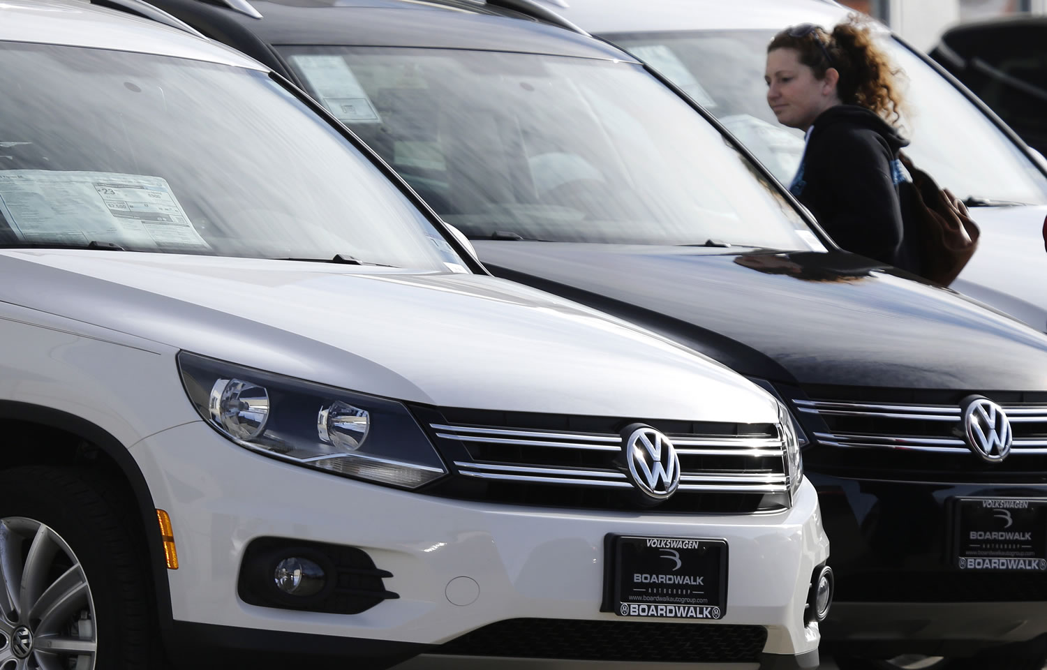 LM Otero/Associated Press
Meredith Havens looks at Volkswagens at a dealership in Richardson, Texas. Volkswagen reported its best February since 1973. The company's sales were up 3 percent. Sales of the new Beetle nearly tripled in February.