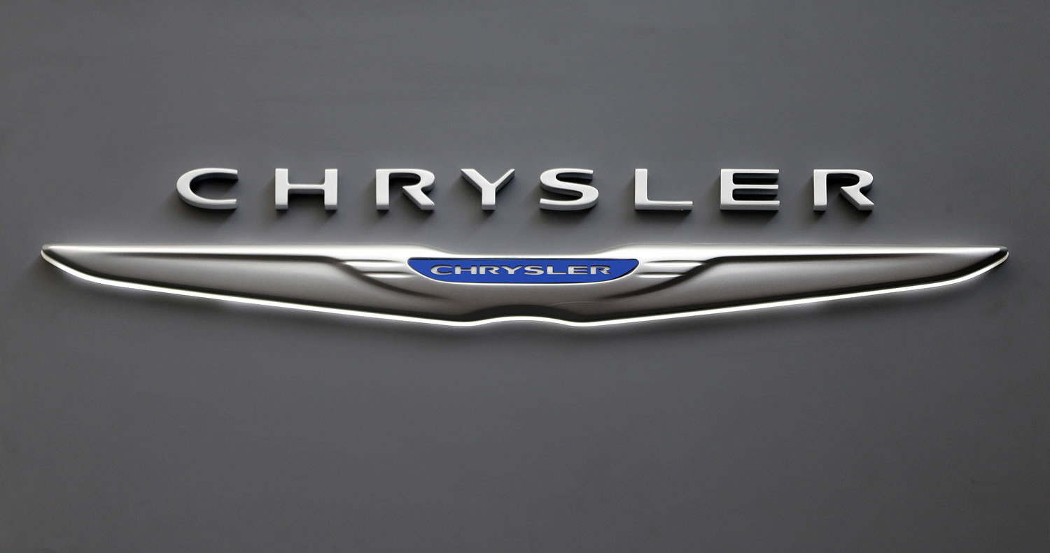 A Chrysler logo on a sign at the 2013 Pittsburgh Auto Show in Pittsburgh. Sales from the major automakers are expected to show that confident U.S.