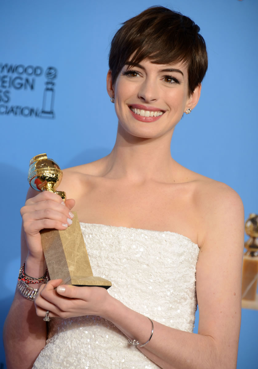 Anne Hathaway holds the award for best performance by an actress in a supporting role in a motion picture for her work in &quot;Les Miserables&quot; backstage at the 70th Annual Golden Globe Awards at the Beverly Hilton Hotel in Beverly Hills, Calif.