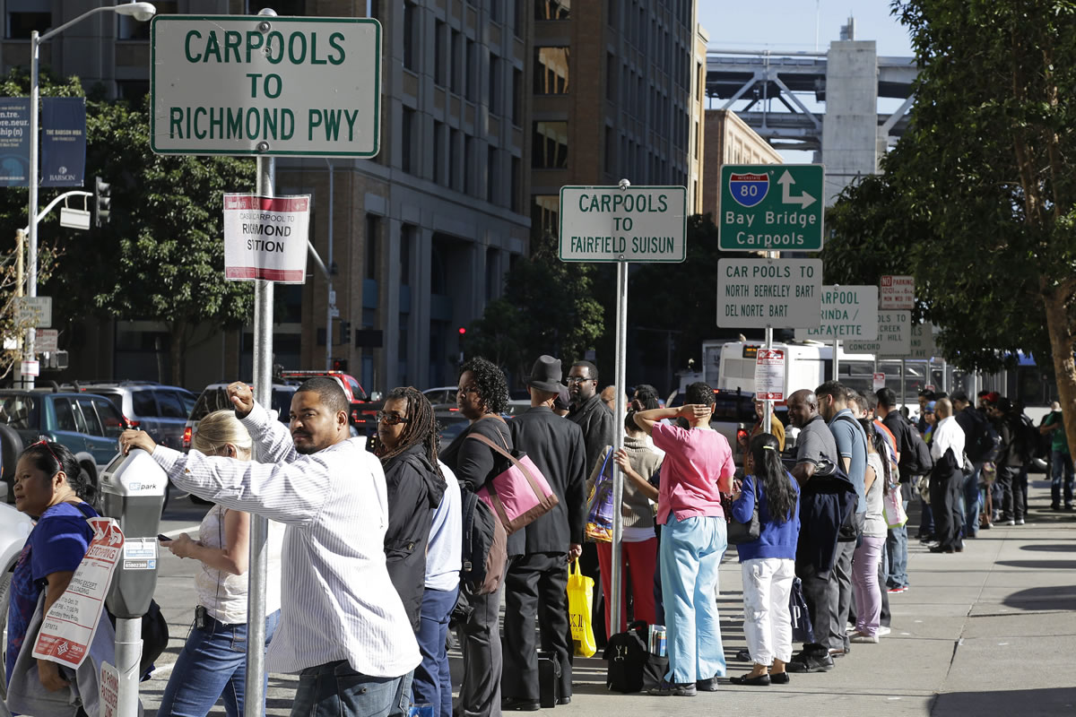People line up for carpool rides Friday  in San Francisco.