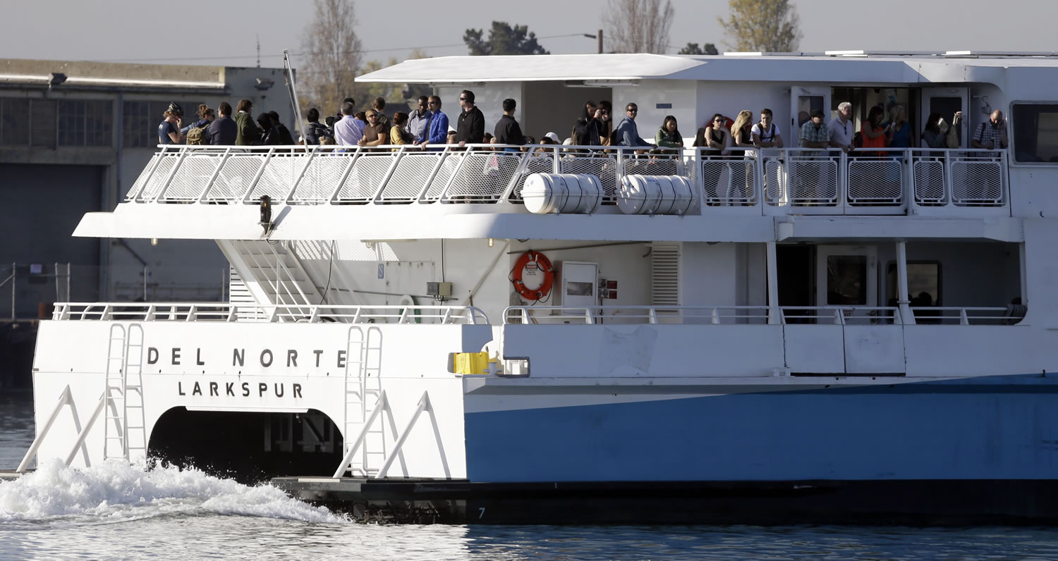 Commuters ride a ferry en route to San Francisco on Friday in Oakland, Calif.