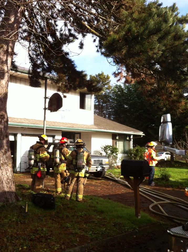 Firefighters work at the scene of a fire in Vancouver's Northwest Neighborhood today.