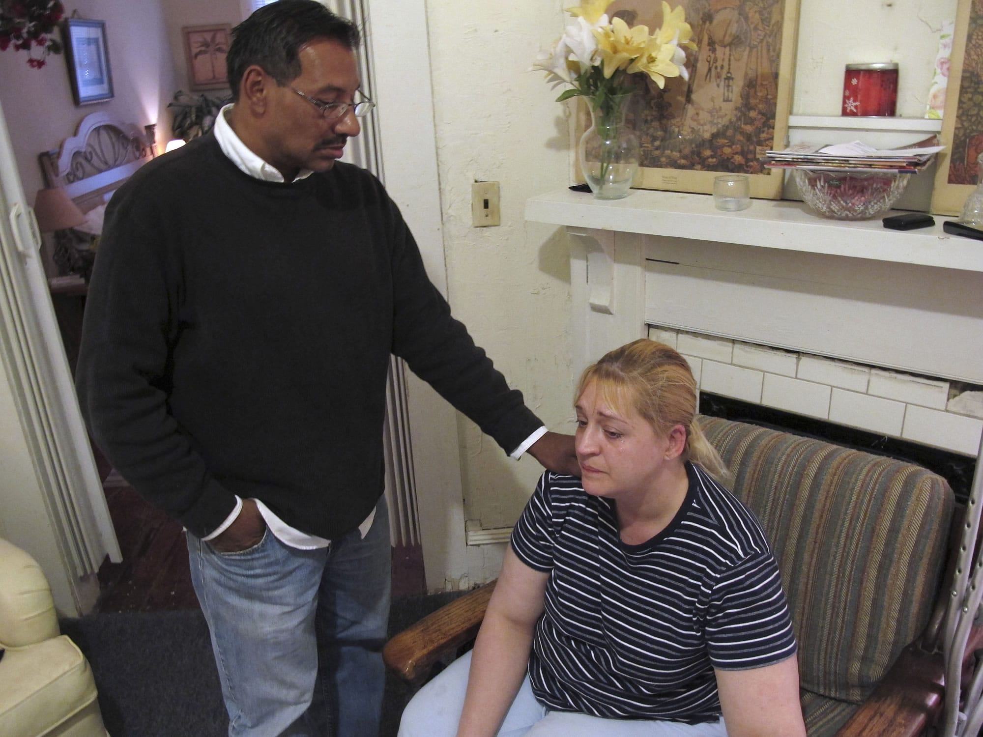 Luis Santiago tries to comfort Sherry West at her apartment Friday, March 22, 2013, in Brunswick, Ga., the day after their 13-month-old son, Antonio Santiago, was shot and killed.