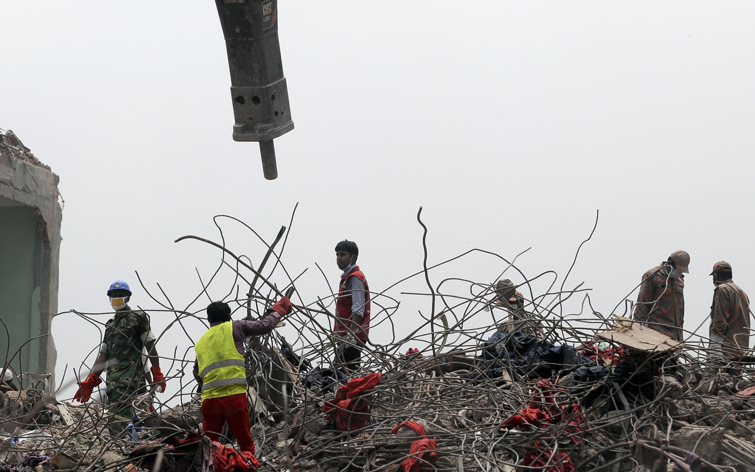 Rescuers work at the site of the eight-story Rana Plaza building that collapsed in Savar, near Dhaka, on Thursday.