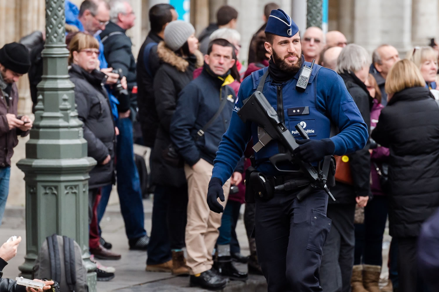 An armed police man patrols at the Grand Place in Brussels on Tuesday.