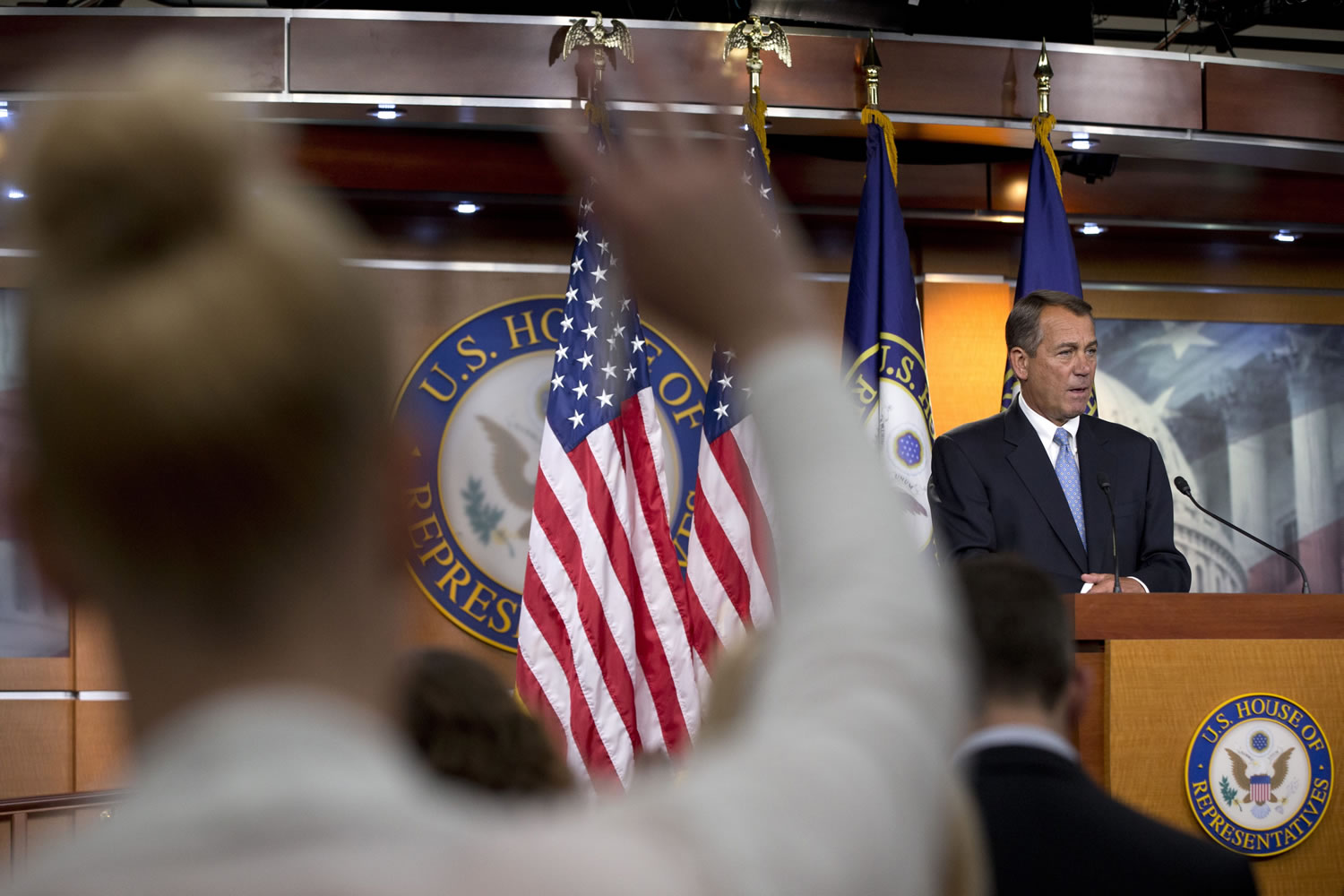 A reporter raises her hand to ask a question of House Speaker John Boehner of Ohio during a news conference on Capitol Hill in Washington on Thursday.