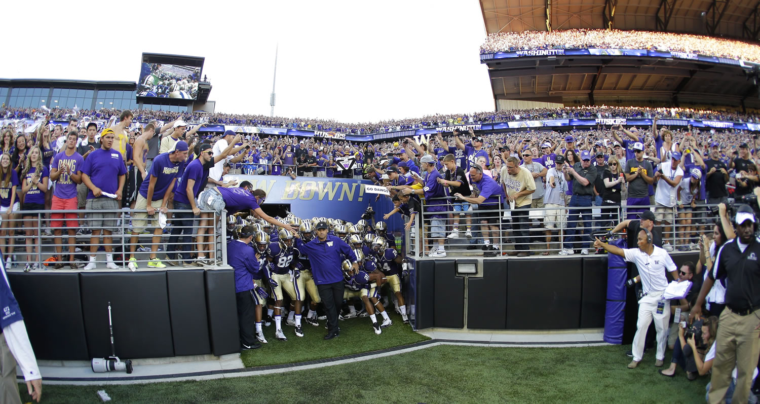 Washington head coach Steve Sarkisian prepares to lead his team out of the tunnel into newly renovated Husky Stadium on Saturday.