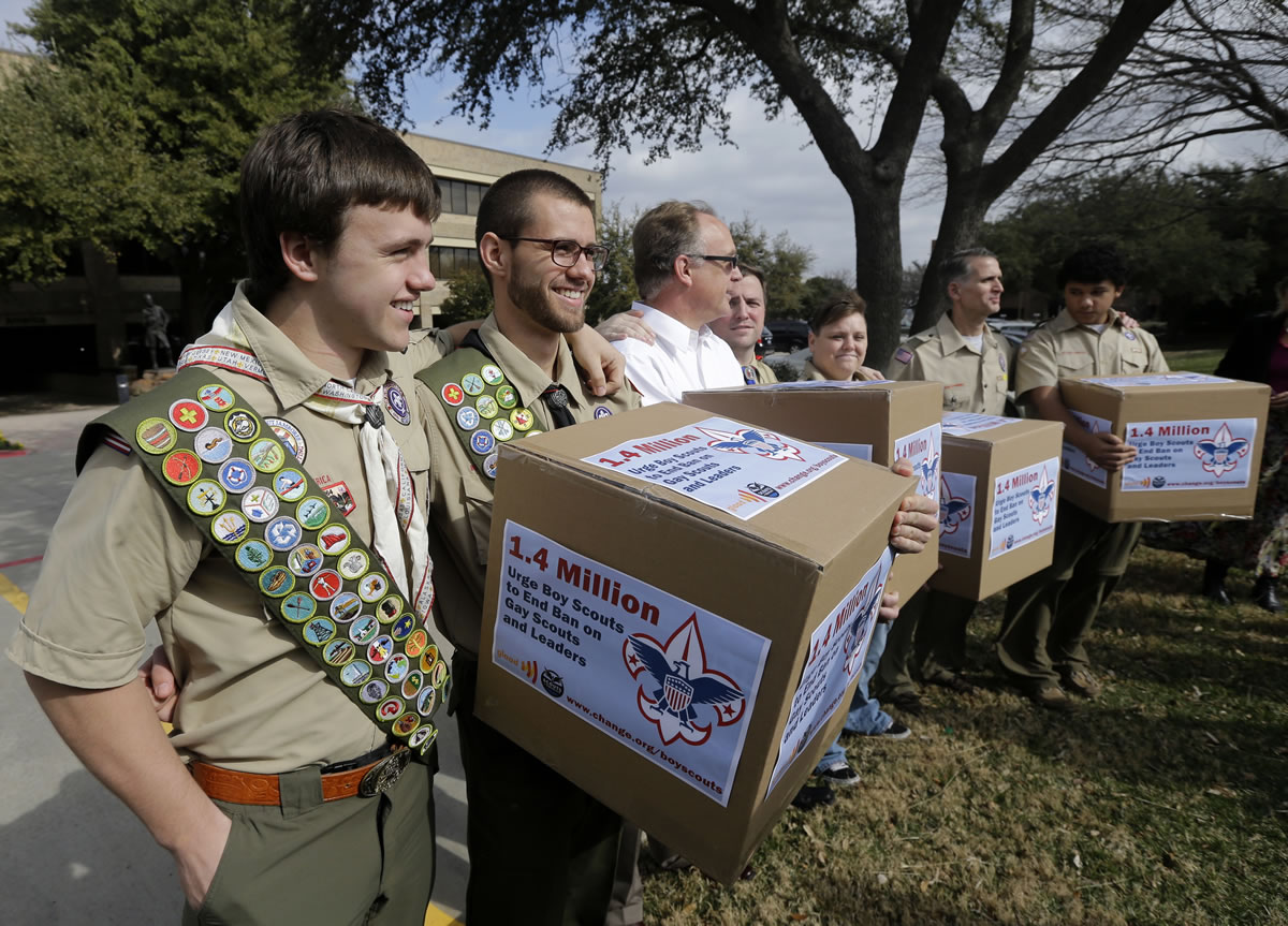 James Oliver, left, hugs his brother and fellow Eagle Scout, Will Oliver, who is gay, as Will and other supporters carry four boxes filled with a petition to end the ban on gay scouts and leaders in front of the Boy Scouts of America headquarters in Dallas, Texas in February. Under pressure over its long-standing ban on gays, the Boys Scouts of America is proposing to lift the ban for youth members but continue to exclude gays as adult leaders.
