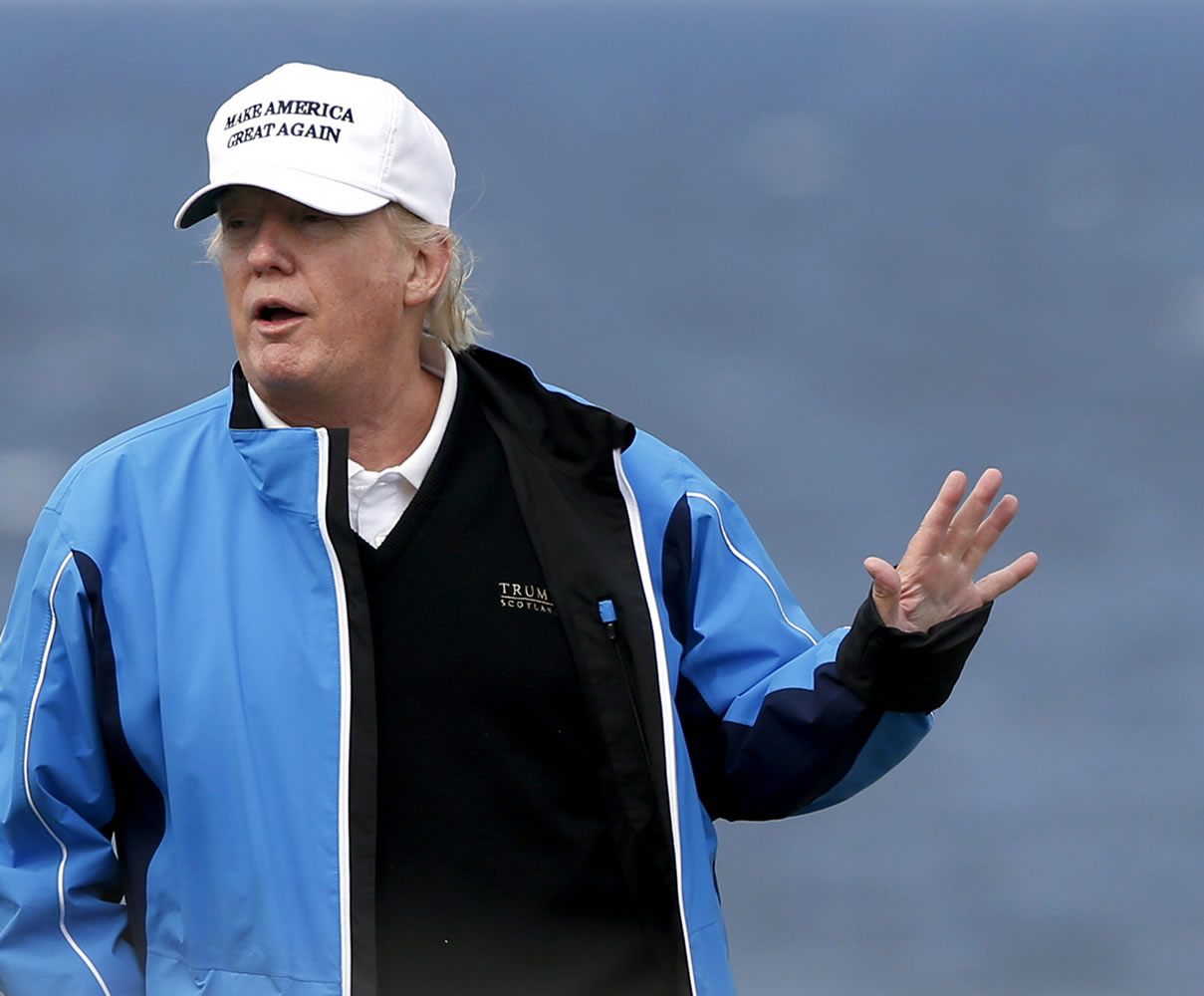 U.S. presidential contender Donald Trump poses for the media during the third day of the Women&#039;s British Open golf championship on his Turnberry golf course in Turnberry, Scotland, in August. Britain&#039;s Supreme Court on Wednesday ruled unanimously against tycoon and U.S. presidential contender Donald Trump in his pitched battle to stop the construction of an offshore wind farm near his upscale Scottish golf resort.