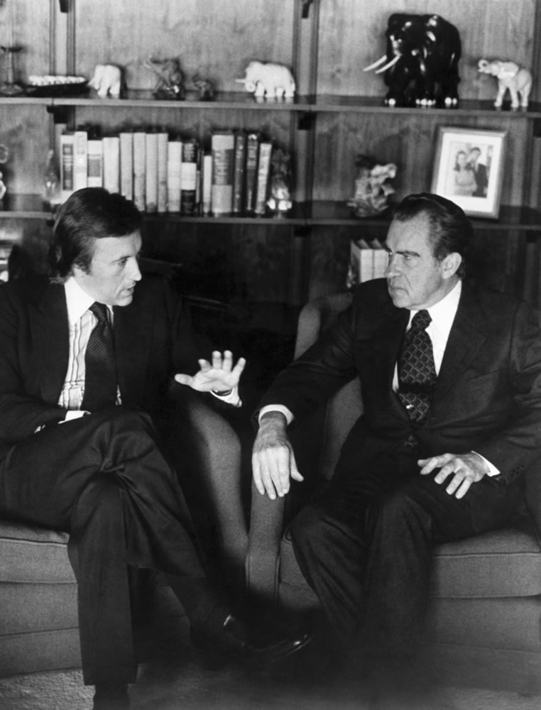 David Frost, left, talks with former President Richard Nixon in this March 1977 file photo prior to the taping of his interview with the former president. The veteran broadcaster, who won fame around the world for his interview with Nixon, has died, his family told the BBC.