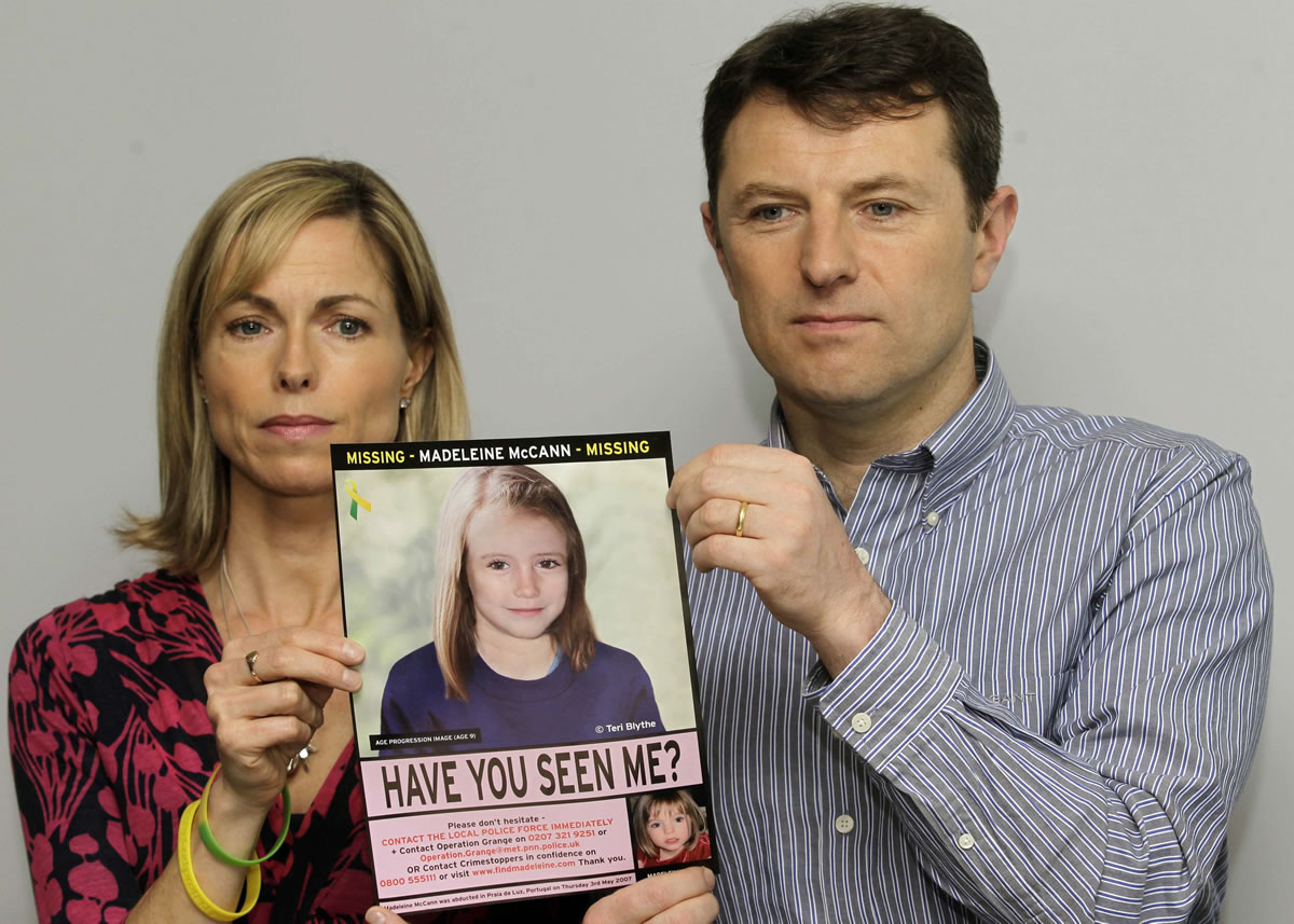 Kate and Gerry McCann pose for the media in 2012 with a poster that shows a computer-generated age-progression image of how their daughter, Madeleine, might look at 9 years of age.