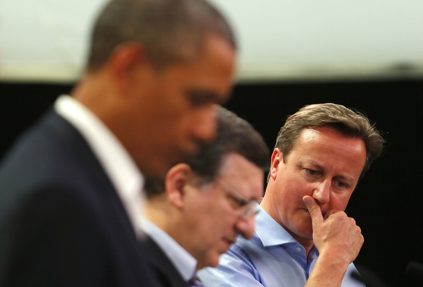 Britain's Prime Minister David Cameron, right, attends a news conference with U.S.