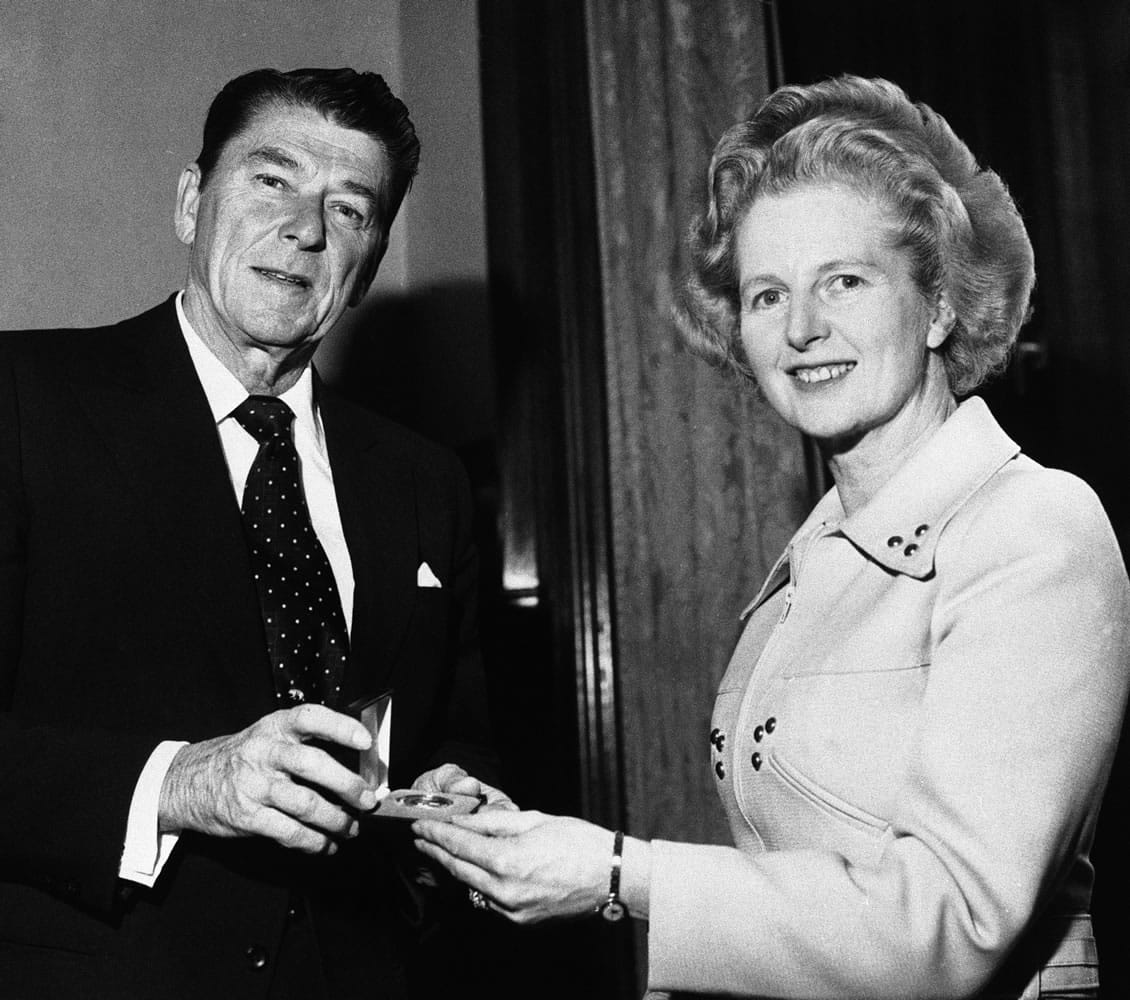 Associated Press files
Then-California Governor Ronald Reagan presents a silver dollar medallion to Opposition Leader Margaret Thatcher when he visited her office April 9, 1975, at the House of Commons in London. Thatcher died Monday morning. She was 87.