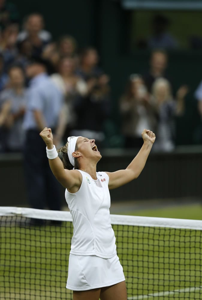 Kirsten Flipkens of Belgium reacts after defeating Petra Kvitova of the Czech Republic in a quarterfinal match at Wimbledon.