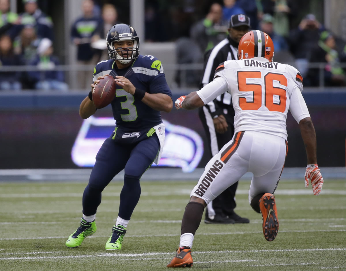 Seattle Seahawks quarterback Russell Wilson in action against the Cleveland Browns in the first half of an NFL football game, Sunday, Dec. 20, 2015, in Seattle. (AP Photo/Ted S.