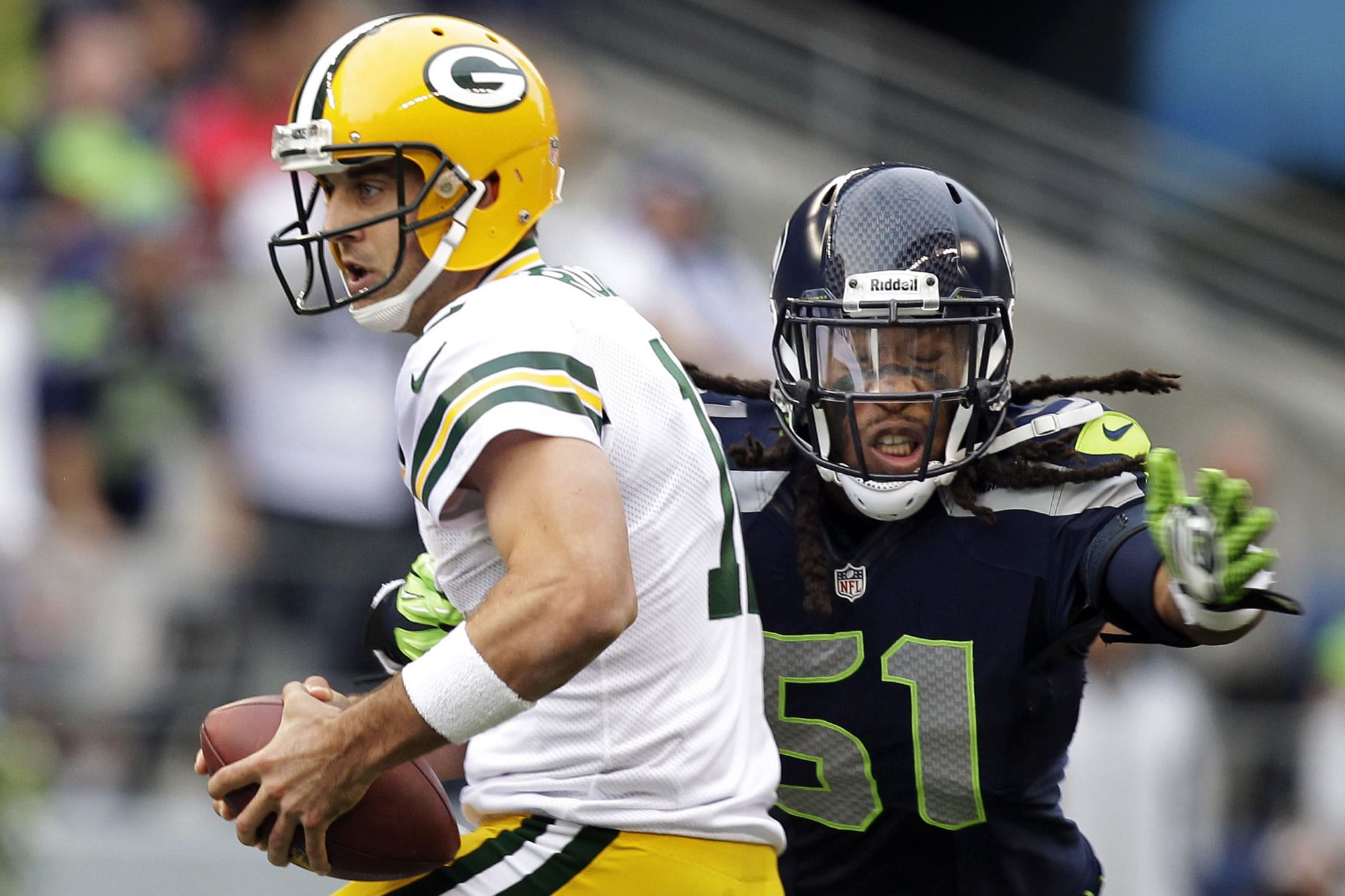 Packers quarterback Aaron Rodgers, left, is sacked by Seahawks defensive end Bruce Irvin earlier this season.