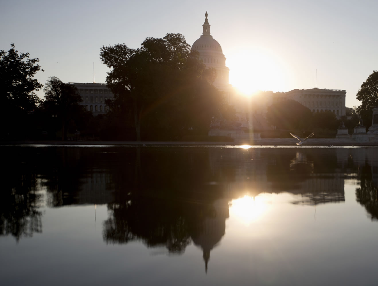 The sun rises behind the Capitol in Washington on Wednesday.
